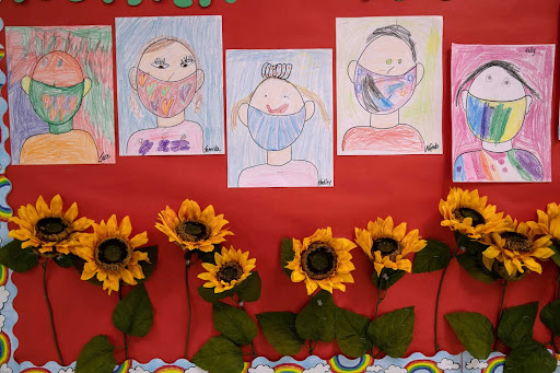 Drawings of children wearing masks adorn a hallway at Stark Elementary School on Sept. 16, 2020, in Stamford, CT.