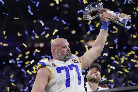 Los Angeles Rams offensive lineman Andrew Whitworth holds up the Vince Lombardi trophy while celebrating his team’s win over the Cincinnati Bengals. Whitworth is also this year’s NFL Walter Payton Man of the Year… this award is given to a player who’s off-the-field actions have impacted members of the community.