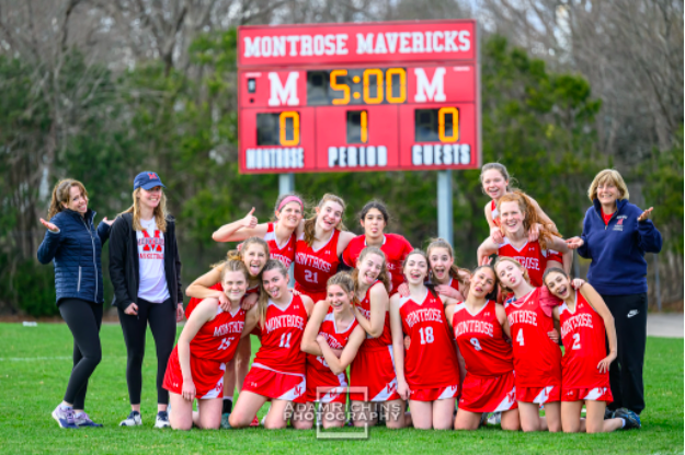 The+varsity+lacrosse+team+poses+for+a+team+photo+before+their+game+on+Friday.
