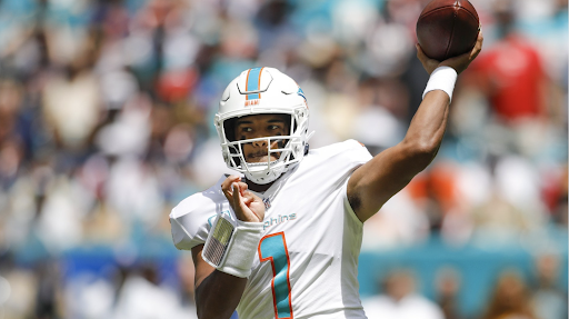 Miami Dolphins quarterback Tua Tagovailoa makes a touchdown pass, contributing to his team’s huge win over the New England Patriots.