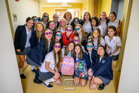 The senior class of 2023 gathered to take a last first day of school picture wearing their matching heart-shaped glasses.