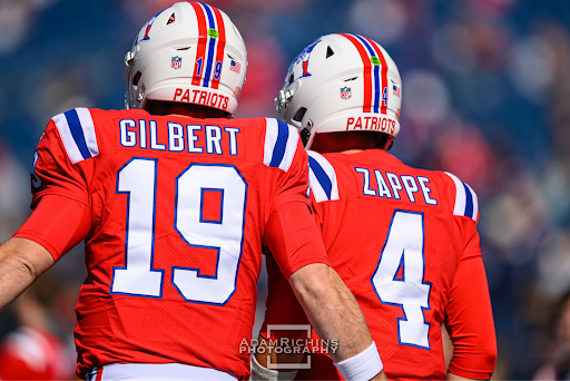 New England Patriots quarterback Bailey Zappe, along with his backup, Garrett Gilbert, warm up for their team’s shutout against the Detroit Lions.