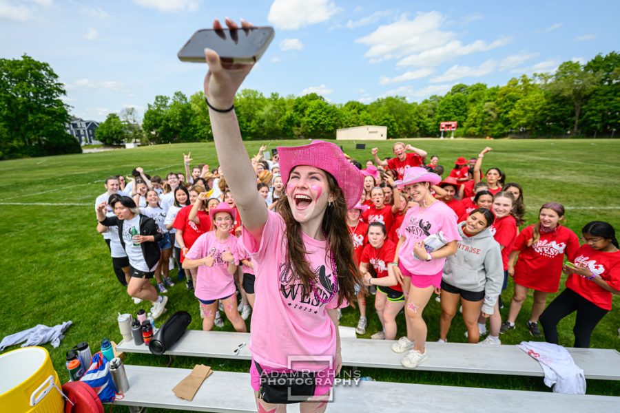 Montrose students snap a 0.5x selfie together on Miracle field. 