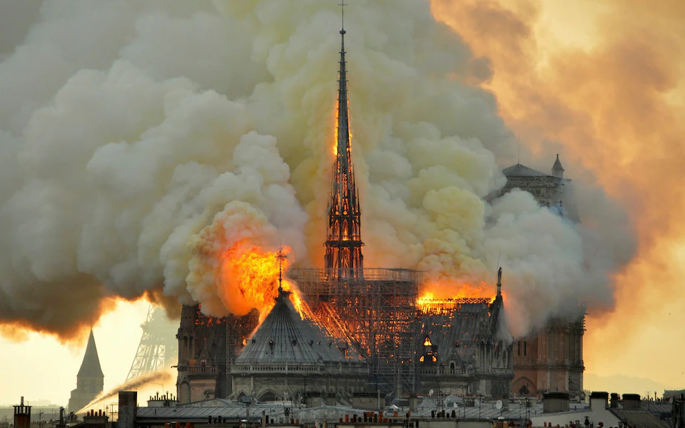 A+photo+of+the+Notre+Dame+Cathedral+as+it+erupted+into+flames+in+April+2019