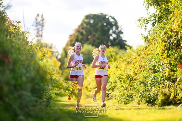 Two of the Montrose Varsity Cross Country team’s seniors Maddy Kerr and Eva Derendorf lead the race at their Homecoming meet. 