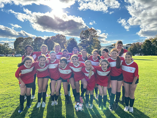 The Montrose JV Soccer players pose together after a game.
