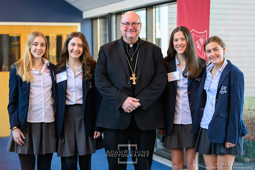 Archbishop Henning with a group of Montrose students during his visit last Thursday.
