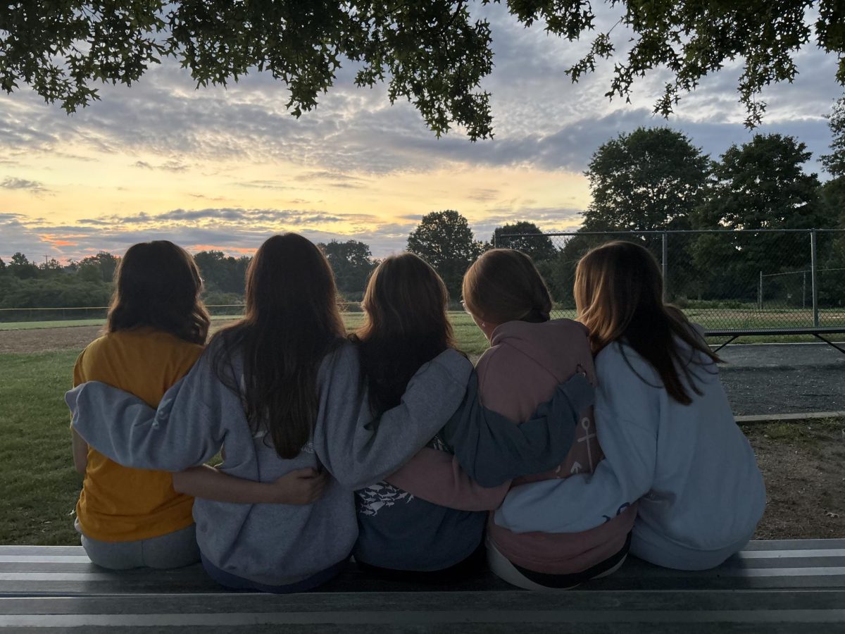 Class of 2027 Seniors enjoy watching the sunrise on McCarthy Field