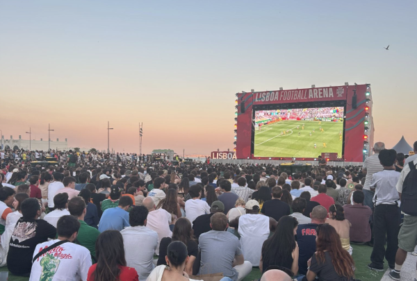 Fans gather to watch World Cup games on the lawn in Lisbon, Portugal