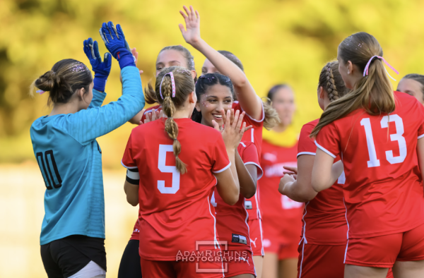 Varsity soccer players celebrate Homecoming win.