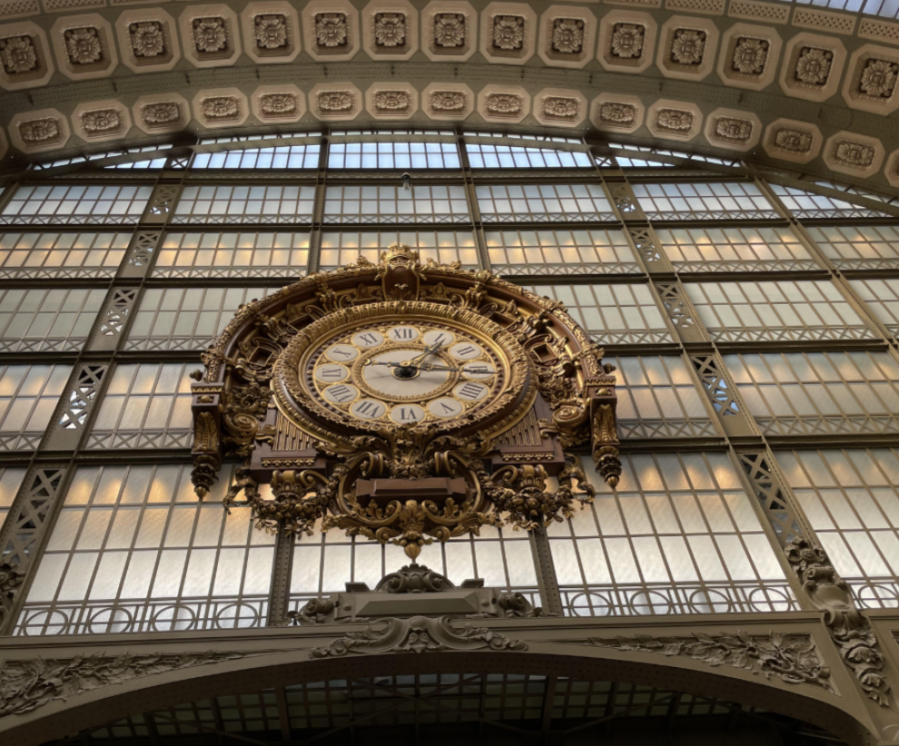 Looking up at the grand clock in the Musee d’Orsay in France. 
