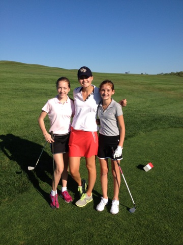 Emma Schiller, Sarah Morrill, Mackenzie Fleming pause in the middle of the action at Sassamon Trace for a photo op.