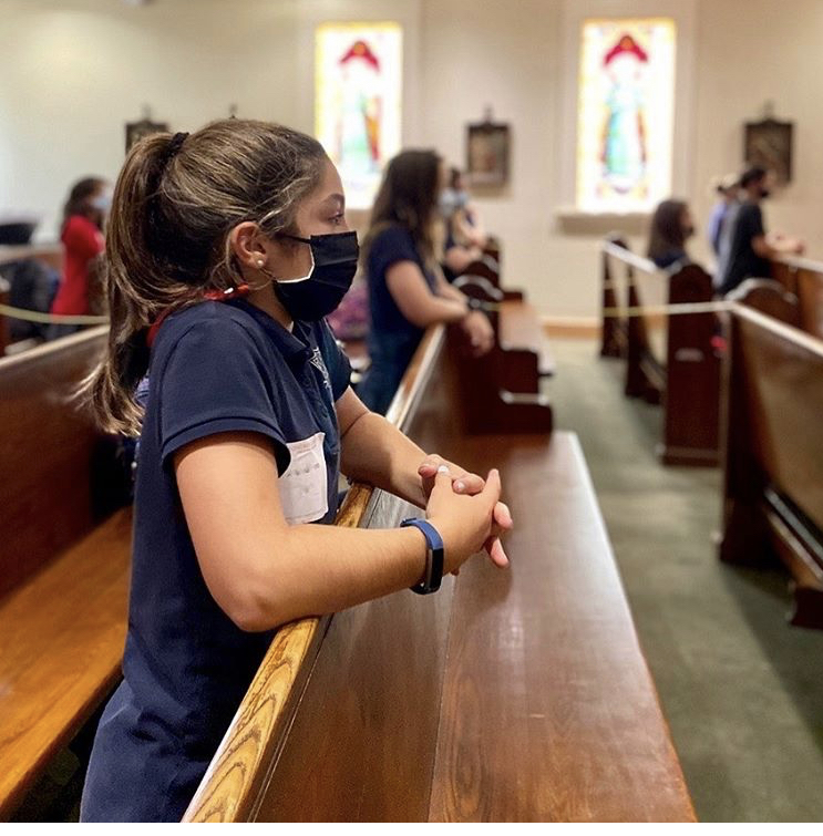 A Montrose seventh grader prays in the chapel during daily Mass.