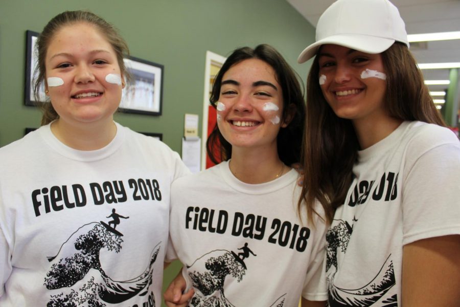 Ally 21 smiles with exchange students Lucia 21 and Elena 21 on field day.